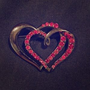 Black and pink brooches